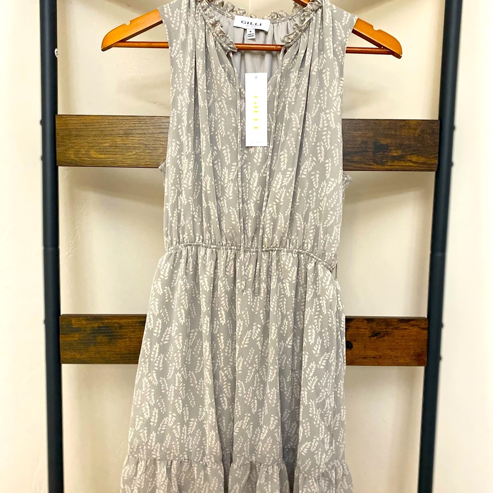 Wonderfully detailed dress with front tie